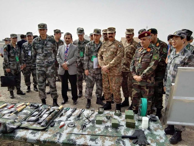 COAS during his visit to exercise area in China witnessing Chinese military equipment display