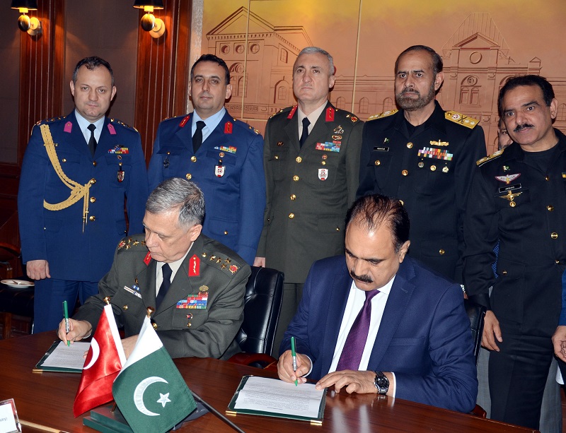 SECRETARY DEFENCE, LT. GEN. (RETD) ZAMEER-UL-HASSAN SHAH AND GENERAL UMIT DUNDAR, DEPUTY CHIEF OF TURKISH GENERAL STAFF, REPUBLIC OF TURKEY SIGNING MINUTES AT MINISTRY OF DEFENCE IN RAWALPINDI ON JANUARY 26, 2017.