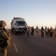 French soldiers search people at a checkpoint on the outskirts of Gao