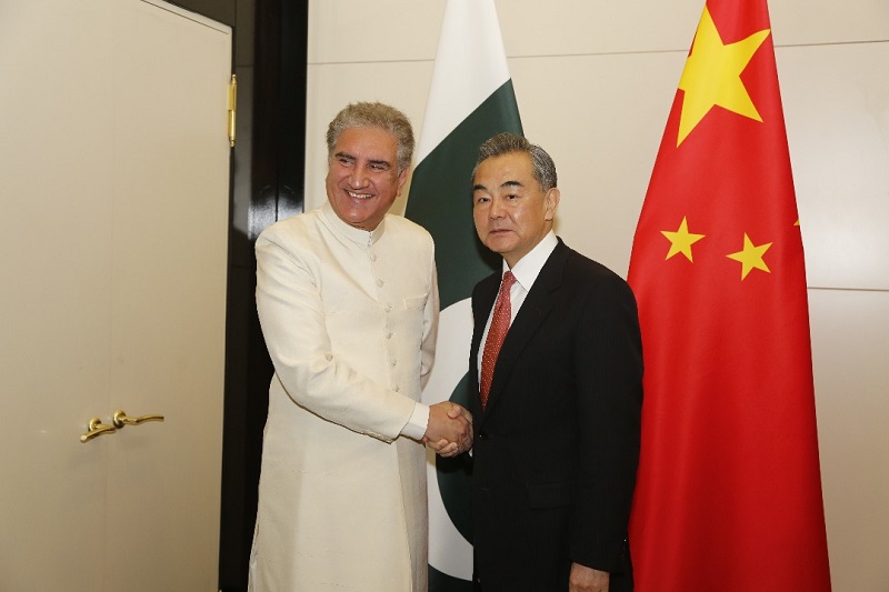China-Pakistan Foreign Ministers’ Strategic Dialogue - The State Councilor and Foreign Minister of the People's Republic of China Wang Yi and the Foreign Minister of the Islamic Republic of Pakistan Shah Mahmood Qureshi held the 2nd Round of China-Pakistan Foreign Ministers' Strategic Dialogue in the Chinese Hainan Province on Friday. The two sides exchanged views on COVID-19 pandemic, Pakistan-China bilateral relations, and international and regional issues of mutual interest, and reached consensus to collectively take measures to safeguard their common interests and promote peace, prosperity, and development in the region. Both sides agreed that Pakistan and China have stood in solidarity and worked together since the COVID-19 outbreak by timely sharing of experiences relating to the prevention and control of the virus, mutual support in providing medical materials, and have set an example for international community to jointly fight the pandemic.  Both sides agreed to further strengthen cooperation in developing a vaccine to defeat the COVID-19 pandemic, and strive to promote establishment of China-Pakistan Community of Shared Future and Community of Common Health.  Both sides emphasized that unity and cooperation are the most powerful weapon for the international community against the disease.  Both sides opposed politicizing the pandemic, labeling viruses; supported WHO to play a leading role in global public health governance, and called for the international community to increase the sense of a community of shared future and carry out effective joint prevention and control measures in order to mitigate the negative effects of COVID-19. Both sides reiterated that the enduring China-Pakistan All-weather Strategic Cooperative Partnership is beneficial to international and regional peace and stability, and serves the mutual security and development interests of both countries as well as of international community and regional countries. Both sides were committed to firmly implementing the consensus reached between the two leaders, enhancing mutual strategic trust, strengthening all-round cooperation, maintaining momentum of high-level exchanges, further advancing construction of Belt and Road Initiative (BRI), promoting bilateral relationship to a higher level, and delivering greater benefits to both countries and the two peoples. Both sides agreed on continuing their firm support on issues concerning each other's core national interests. The Chinese side reiterated that Pakistan and China are iron brothers and Pakistan remains China’s staunchest partner in the region and that China firmly supports Pakistan in safeguarding its territorial integrity, sovereignty and independence, independently choosing a development path based on its national conditions, striving for a better external security environment and playing a more constructive role on international and regional affairs.  The Pakistani side appreciated China for standing together with Pakistan in safeguarding its national security and sovereignty, and reaffirmed its firm support to China on affairs concerning China's core interests and issues of major concern, such as those related to Taiwan, Xinjiang, Tibet and Hong Kong. Both sides underscored that China-Pakistan Economic Corridor (CPEC) has entered the new phase of high-quality development, and has played and will continue to play an important role in supporting Pakistan to overcome the impact of COVID-19 and achieve greater development.  The two sides will continue to firmly advance the construction of CPEC, ensure in-time completion of those projects under construction, focus on economic and social development, job creation and improvement of people's livelihood, and further strengthen cooperation in Specialized Economic Zones (SEZs), industrial relocation, science and technology, medical and health, human resources training, poverty alleviation, and agriculture etc., with the aim to continuously unleash the great potential of CPEC to make it a hub of regional connectivity.  Both sides expressed satisfaction on agreements reached on recent mega energy projects and look forward to convening the 10th JCC meeting at the earliest possible date to promote CPEC to make positive contributions to the high-quality construction of BRI. Both sides reaffirmed the principle of wide consultation, joint contribution and shared benefits in building CPEC, and welcomed the international community to join in the CPEC construction on the basis of consensus to achieve shared development. Both sides expressed satisfaction over cooperation on regional and international issues at multilateral fora such as the UN, Shanghai Cooperation Organization and ASEAN Regional Forum, and agreed to deepen coordination and cooperation to safeguard mutual interests and uphold principles of fairness and justice. Both sides reaffirmed their commitment to the purposes and principles of the UN Charter, and support for multilateralism, free trade and win-win cooperation, and opposition to unilateralism, protectionism and coercive practices. Both sides underlined that a peaceful, stable, cooperative and prosperous South Asia was in common interest of all parties. The parties need to settle disputes and issues in the region through dialogue on the basis of equality and mutual respect.  The Pakistani side briefed the Chinese side on the situation in Jammu & Kashmir, including its concerns, position and current urgent issues.  The Chinese side reiterated that the Kashmir issue is a dispute left over from history between India and Pakistan, which is an objective fact, and that the dispute should be resolved peacefully and properly through the UN Charter, relevant Security Council resolutions and bilateral agreements. China opposes any unilateral actions that complicate the situation. Both sides agreed to strengthen cooperation on the Afghan issue and appreciated the efforts made by Afghan government and the Taliban to initiate the intra-Afghan negotiations. They emphasized the importance of an inclusive, broad-based and comprehensive negotiated agreement for future political settlement in Afghanistan.  While reaffirming their commitment to an Afghan-led and Afghan-owned Peace Process, both sides encouraged relevant parties in Afghanistan to seize this historic opportunity and commence the Intra-Afghan Negotiations at the earliest leading to durable peace and stability in Afghanistan.  China appreciated Pakistan’s positive contribution to the Afghan peace process and efforts for promoting peace and stability in region and beyond. Both China and Pakistan reaffirmed the vitality of the time-tested and All-Weather Strategic Cooperative Partnership between the two Countries which remains unaffected by the vicissitudes of the regional and international developments and continues to move from strength to strength.