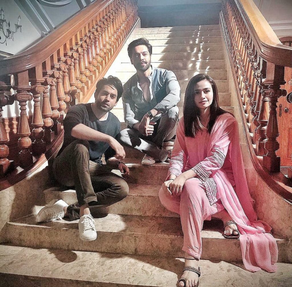 Sana Javed Teases BTS From Her Upcoming Drama Sana Javed has risen to new fame with her acting talent. In the recent, back to back dramas, she has only performed a distinction-worthy performance and deserves not only praises but awards and accolades. This is why, drama lovers and critics have been keeping an eye on what she is up to next, so they can add that to her upcoming list. We all know she is currently working with Bilal Abbas Khan and Fahad Mustafa on Big Bang’s production, Dunk. Now, she has also started teasing us with her look and the other BTS of the drama serial. Amal’s First Look in Dunk: You might have guessed who Amal is. Sana, a few days ago, revealed her character name in an Insta post along with her first look. Captioned as Amal, Sana’s picture was that of a desi Pakistani girl who is not only breathtaking but is Eastern to the core. She tagged Fahad Mustafa and Badar Mehmood both in the post, who are the brainchild of this drama. In soft pink Shalwar suit, Sana looks absolutely breathtaking as Amal in simple attire. You can have a look here: Amal & Haider Together: In another post, Sana has finally given a couple pictures of the leading stars of the drama. We already knew she was starring opposite Bilal Abbas Khan for the first time in this drama, but their picture has given us a couple goals already. We are rooting to see their chemistry on-screen, and how their couple will turn out to be. In this post, she revealed Bilal’s name as Haider. Captioned as Haider – Amal, we know they are going to be the IT couple of the drama. Here is her post: A Look From The Drama Scene In the final Insta story, Sana and the entire cast and team of Dunk have shared a similar story set in the scene taken from the drama. You can see Sana, Bilal, and Fahad Sheikh among others. The story is a snippet of multiple photos probably taken off the director’s shot while being guided about the scenes. Dunk also has its official Instagram account where you can catch up the glimpses of what’s happening behind the scenes, media coverage, press attention, and almost everything else that’s happening. Here is one such clip of the BTS of the drama serial. We are over-excited about seeing Sana Javed and Bilal Abbas together for the first time. They are both extremely popular individually and we can only wait to see the magic they create together. 