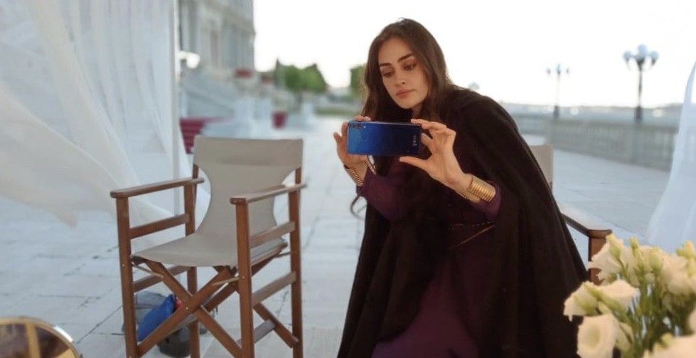 Great news has surfaced earlier today that the most loved and famous Turkish actress Esra Bilgic has become brand ambassador of QMobile. Esra Bilgic is well-known and crazily admired for her lead role in Turkish series Diriliş: Ertuğrul, aka Halime Sultan. Pakistani fans greatly admire her for her enchanting beauty. According to the details, Esra Bilgic would be seen as Brand Ambassador of QMobile’s View Max Pro series which makes QMobile the first Pakistani brand to have any celebrity from Diriliş: Ertuğrul series on board. The CEO and Chairman of QMobile, Mr, Zeeshan Akhtar commented that, “It has always been our vision to bring innovation in Pakistan through our products, technology, and advertising. During the current times, we hope that this project will be a pleasant surprise for the Pakistani audiences and a benchmark for more collaborations of Pakistani brands with global celebrities”. Esra Bilgic’s Declaration to work with Pakistani Brands The love of the fans from Pakistan for Esra Bilgic is on the one end and the actress’s response came up as a post in Urdu language which turned out to be great surprise for everyone. Esra Bilgic left her fans from Pakistan in surprise with a post in Urdu language on her Instagram where she hinted that she is all set and willing to work for Pakistani brands. According to details, in an interview, Esra Bilgic had earlier spilled the beans over her will to work with popular Pakistani brands and she said that she will soon be working on it. Esra revealed this amazing news and shared it with her fans on Instagram in a post written in Urdu language. Esra Biligic and Peshawar Zalmi It was hinted by Peshawar Zalmi owner Javed Afridi earlier that Esra Bilgic will be associating with Peshawar Zalmi as brand ambassador however, this race between different brands to proceed with Esra Bilgic as brand ambassador continued and now QMobile won it at first. About Esra Bilgic Esra Bilgiç is a Turkish actress and a model, born on 14th of October, 1992. She is only 28 years old. She has studied at the Bilkent International University in Istanbul, Turkey. Esra Bilgiç Career Esra Bilgiç starred in the TV series Diriliş: Ertuğrul telecast on TRT 1 from 2014. Her co-actors were Engin Altan Düzyatan and Hülya Darcan. Diriliş: Ertuğrul is about the heroic story of the father of Osman I, Ertuğrul, who turns a small tribe of Anatolya into a Sultanate. Esra Bilgiç appeared as Halime Hatun in the series, but in 2018 she left Diriliş: Ertuğrul because of the changes in the new season; her character, however, died in 1281, and not as early as it was shown in the TV series. Esra also appeared in Bir Umut Yeter. In 2019, Bilgiç was asked to play a leading role in the film Adaniş Kutsal Kavga. The film will be released in March, 2020. She is currently the female lead in the Turkish crime-drama TV series Ramo, with co-stars Murat Yıldırım. She has won five awards as Best Female actress for Diriliş: Ertuğrul from year 2014 to 2016. Her work in this series is being considered as remarkable of all times. She gained much popularity from this series and that’s the reason she has around 2.5 M followers on her Instagram.
