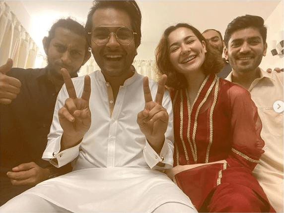 Hania Amir and Asim Azhar have been in the news following their ‘friendzoned’ relationship. The couple has been the talk of the town about the way they have been sharing happy moments of their life together. However, the story got a twist when Hania Amir recently declared in a live session on Instagram with Aima Baig that Hania and Asim are “Just friends”.   Hania and Asim Celebrate Eid-ul-Adha Together   Well… something interesting is on the surface now as Hania and Asim shared some adorable pictures from their post break-up Eid celebrations. So, fans are again in a state of confusion now as this ‘friendzoned’ couple has celebrated Eid-ul-Adha with their friends together.  Hania, who recently revealed that she and Asim are not in a relationship, turned to Instagram and shared sweet photos with Asim and other friends. Asim and Hania seemed overjoyed in the pictures along with other friends which depicted as everything so normal. So, what’s cooking inside? No one knows yet until Hania and Asim say something about it.  Hania wished Eid Mubarak on her Instagram while sharing some adorable pictures from Eid-ul-Adha celebrations. She wrote, “The struggle to get jahanzeb bhai in the picture was real. Eid Mubarak.” Not only that but Asim Azhar made the game even more interesting while commenting on the post, “Jaanu bhai trying to fit in at the back is a mooood.”  Moreover, before this photo session, Asim shared his mirror selfie with his mother in the same outfit he was seen in the photo with Hania and his other friends. He captioned the adorable selfie, “Me, Ama aur Eid wali mirror selfie #EidMubarak.”  About Asim Azhar  Asim Azhar is a Pakistani singer, songwriter and actor. He started his career as a singer on YouTube, re-singing contemporary Western songs before he became a public figure.  About Hania Amir  Hania Amir is a Pakistani film and television actress, model and singer. While studying at the Foundation for Advancement of Science and Technology, Amir made several dubsmashs and uploaded them on her social media account, which got the attention of the producer Imran Kazmi, who later cast her in a supporting role in the blockbuster romantic comedy Janaan (2016)–a role which earned her a Lux Style Award for Best Supporting Actress nomination. Her subsequent appearance in the Sunsilk commercial made her one of the most sought-out media personalities in Pakistan. Hania Amir rose to prominence with the role of a beauty-obsessed unfaithful wife in the romantic television series Titli (2017), and a girl next door in the melodrama Visaal (2018). She achieved further success by featuring as the female lead in the action comedy Na Maloom Afraad 2 (2017), and the aerial combat-war Parwaaz Hai Junoon (2018), both of which rank among the highest-grossing Pakistani films of all time, and drew praise for her performances in the 2019 romantic television series Anaa.