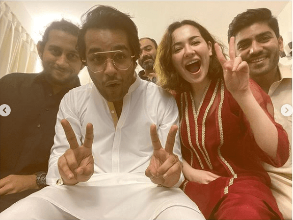 Hania Amir and Asim Azhar have been in the news following their ‘friendzoned’ relationship. The couple has been the talk of the town about the way they have been sharing happy moments of their life together. However, the story got a twist when Hania Amir recently declared in a live session on Instagram with Aima Baig that Hania and Asim are “Just friends”.   Hania and Asim Celebrate Eid-ul-Adha Together   Well… something interesting is on the surface now as Hania and Asim shared some adorable pictures from their post break-up Eid celebrations. So, fans are again in a state of confusion now as this ‘friendzoned’ couple has celebrated Eid-ul-Adha with their friends together.  Hania, who recently revealed that she and Asim are not in a relationship, turned to Instagram and shared sweet photos with Asim and other friends. Asim and Hania seemed overjoyed in the pictures along with other friends which depicted as everything so normal. So, what’s cooking inside? No one knows yet until Hania and Asim say something about it.  Hania wished Eid Mubarak on her Instagram while sharing some adorable pictures from Eid-ul-Adha celebrations. She wrote, “The struggle to get jahanzeb bhai in the picture was real. Eid Mubarak.” Not only that but Asim Azhar made the game even more interesting while commenting on the post, “Jaanu bhai trying to fit in at the back is a mooood.”  Moreover, before this photo session, Asim shared his mirror selfie with his mother in the same outfit he was seen in the photo with Hania and his other friends. He captioned the adorable selfie, “Me, Ama aur Eid wali mirror selfie #EidMubarak.”  About Asim Azhar  Asim Azhar is a Pakistani singer, songwriter and actor. He started his career as a singer on YouTube, re-singing contemporary Western songs before he became a public figure.  About Hania Amir  Hania Amir is a Pakistani film and television actress, model and singer. While studying at the Foundation for Advancement of Science and Technology, Amir made several dubsmashs and uploaded them on her social media account, which got the attention of the producer Imran Kazmi, who later cast her in a supporting role in the blockbuster romantic comedy Janaan (2016)–a role which earned her a Lux Style Award for Best Supporting Actress nomination. Her subsequent appearance in the Sunsilk commercial made her one of the most sought-out media personalities in Pakistan. Hania Amir rose to prominence with the role of a beauty-obsessed unfaithful wife in the romantic television series Titli (2017), and a girl next door in the melodrama Visaal (2018). She achieved further success by featuring as the female lead in the action comedy Na Maloom Afraad 2 (2017), and the aerial combat-war Parwaaz Hai Junoon (2018), both of which rank among the highest-grossing Pakistani films of all time, and drew praise for her performances in the 2019 romantic television series Anaa.