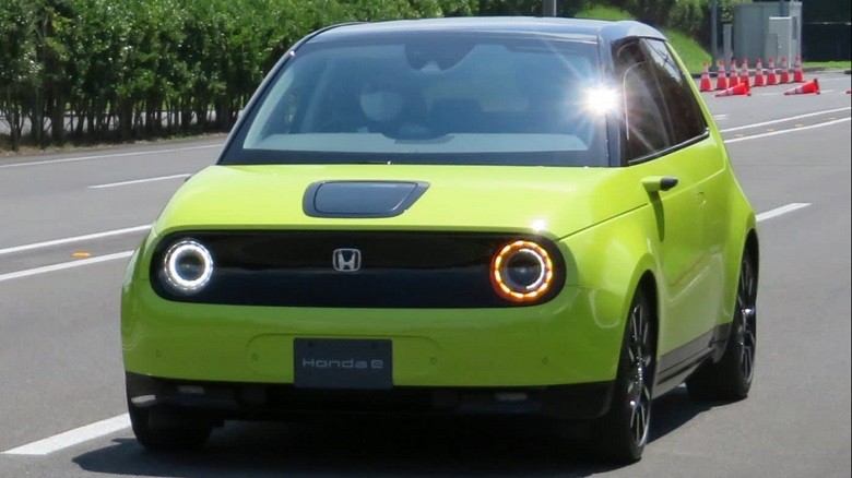 Honda E - Honda motor is all set to launch its first all-electric mini hatchback in October 2020.  The new Honda e or EV (every man’s Electric Vehicle) will first be launched in Japan. The Honda E will be priced at around $42,000. The company had focused the car for urban use, fitted with cameras instead of door mirrors, the EV will go on sale on October 30.  The Honda e has a battery capacity of 35 KW/h which can travel 300 km on a single charge.  The car is less than 4 meters long forcing it to reduce the size and capacity of the battery. According to Honda's senior chief engineer, “Its smallness is a big attraction,".  The car has new parking sensors which will make it easier to park in narrow spaces.  Just like the most expensive Lamborghini, the door mirrors have been removed so that the rear of the car can be seen on a screen inside through a camera and Honda claims that the image will be clear even in rain.  The dashboard of the car has five screens arranged horizontally to provide a driving experience of its own kind.  The battery charger is a 3-pin plug capable of charging the car for zero to full in about 4 hours, it is on fast charging. The car is a rare wheel drive with a horsepower of 154 while the lowest version of the car is 136 horsepower.  The car has 6 airbags a panoramic sunroof, adaptive cruise control with lane keep assist and a radar detection feature, heated steering wheel and a regenerative braking feature.   The Honda e’s price is lower than the other rivals but it is the same as Tesla's Model 3. The computation sure is tough for Honda because Toyota Motor launched its first EV from its Lexus luxury brand and other big Japanese carmakers are accelerating their EV productions.
