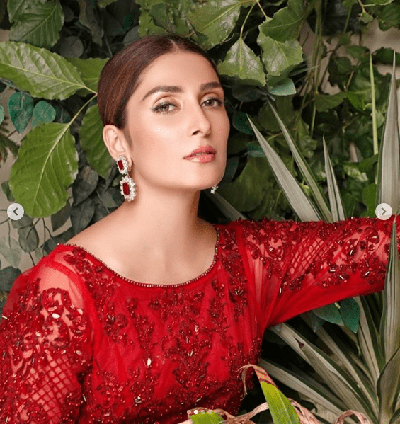 Check out this latest photoshoot of Ayeza Khan in which she is wearing a finely designed fancy red attire by Maryam Hussain. This attire seems like making a comeback for lengthy open-shirt fashion. The light sprinkle of embellishment has added up to the elegance of this dress. Ayeza has captioned this photoshoot as one of the favorites. Take a look!