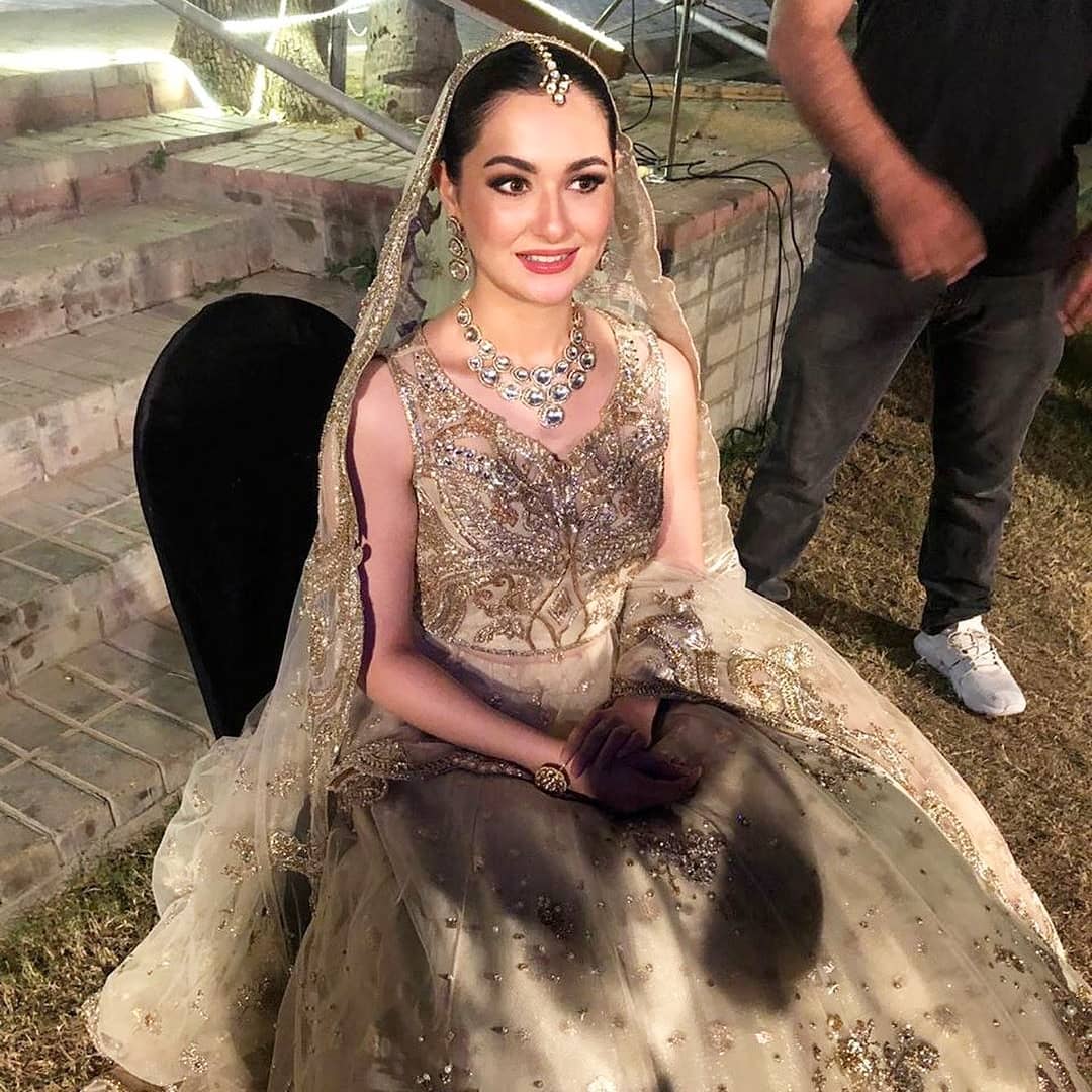 Hania Amir has been in the news for recent speculations related to her engagement on social media. Twitter was brimming with the tweets under the hashtag #منگنی_مبارک_ہانیہ or #HaniaMangniMubarak making people invest all of their time and attention towards this big news. Everyone was congratulating Hania Amir for her engagement and not stop tweets were sending notifications to her phone. Has Hania finally got engaged to Asim Azhar? What is the reality of this Twitter trend? Here we have got the details! Hania Amir's Engagement - What Are The Facts? As soon as the trend picked hype of Twitter, all of Hania's fans gathered to express their excitement however, just then they got to know the real picture of this news.  Initially, everyone was wondering about who is behind starting this trend as there wasn't any official statement in this regard. To know the reality, a dig down deep attempt to get the facts took place and it popped the bubble of the fans. Before you get to know the facts, here we have got some tweets from this #منگنی_مبارک_ہانیہ trend. Take a look! These are some of the interesting tweets that surfaced as this Hania's engagement trend began to spread around.  What Was The Reaction of Hania Amir? Hania made it a bit late to check out the series of notifications after the continuous pinging of her phone. However, when she checked it, she was surprised and enjoyed all these tweets. The reason that she considered this trend and all tweets hilarious was that she is actually single and the news was definitely not about her. But, if it was not Hania Amir, then who is the one trending under #منگنی_مبارک_ہانیہ? Who is That Hania Trending on Twitter? So, basically that Hania who was trending under #منگنی_مبارک_ہانیہ was a Twitter user with 55K followers. On Hania's engagement, her friends tried to go out of the way in making this event special for her by starting a trend on Twitter. However, the results were different yet entertaining not only for the fans but also for Hania Amir too. Here we have got the tweets that revealed the reality: Hania's Clarification Video! After enjoying this scenario and those of interesting tweets, Hania finally came up with a video to clear that she is still single. For all the fans who are thinking that she has engaged to Asim Azhar; this thought has nothing to do with the reality. Check out Hania Amir's video for the clarification! Meanwhile, when people were imagining that Hania has tied the knot with someone else apart from Asim Azhar, this tweet captured our glance! So, what do you think about this trend and Hania's response? Please share your valuable feedback!