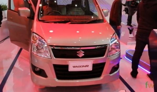 Pak Suzuki Motors introduced the first generation Wagon R in Pakistan back in 2014. The compact 1000cc hatchback received a lot of praise in the local automobile consumer market. In the time of just a year, Wagon R became a highly popular choice of car drivers. Before we talk about Suzuki Wagon R price and other details, let's talk a little about its local launch.  There are several reasons behind the quick popularity of Wagon R in Pakistan. Firstly, Suzuki had not introduced a compact 1000cc hatchback for many years. Although Cultus remained highly successful in the local market ever since its launch, Suzuki fans were looking for a change in terms of driving experience. Another reason is that Mehran owners needed a shift in terms of design, market value, and performance. Suzuki Wagon R is marked as an intelligent move from the company. Equipped with a modern design and comfortable interior, the 1000cc hatchback rose as a favourite choice in the market for the past 6 years. The latest Wagon R (2020) is a front-engine front-wheel-drive car. It includes the new Suzuki K-Series engine that is efficient in delivering fuel economy. The car is launched in 2 variants, Wagon R VXR and Wagon R VXL. Suzuki Wagon R Price and Technical Details Suzuki Wagon R 2020 comes in a compact hatchback design. The decent features include classy headlights, a newly designed front grille, big door mirrors, and rectangular vertical taillights. The car houses a 1000cc K-Series engine that is quieter than other Suzuki engines and produces economical fuel performance. Exterior If we talk about the exterior, the overall outer look is decent. The car has broken the typical design standards observed in other Suzuki cars in Pakistan. Before Wagon R, Suzuki had not introduced an innovative design for a long time. Suzuki Cultus underwent cosmetic changes over the years. However, we did not see any design language upgrades before its latest generation came out. Suzuki Wagon R presents an intelligent design overall. The front end houses side swept big headlights set at a decent distance apart by a large trapezium grille. The grille also includes a chrome accent giving a classy look. You can also find dual circular fog lights on the front. The space on the bumper under the grille houses a trapezium air-intake panel in black. The latest chrome company monogram enhances the premium look and feel of the car. If we look at the rear end, we can find a roof spoiler, rectangular side swept vertical taillights and a hatchback case. It is important to mention here that only the latest model includes a roof spoiler. The previous variants did not have any kind of spoilers. The overall look and feel from the rear end appear compact but well-managed. The sides present a decent car height with comfortable ground clearance. The door handles also match the body colour. Interior If we look at the interior, Wagon R comprises of an elegant colour combination on the trim pieces. You can find beige and black plastic trims on the dashboard. The front, as well as the rear seats, are finished in fabric. The standard features included in Wagon R 2020 are power steering, 2-speaker audio system (front door speakers) and a standard air-conditioning unit. The audi unit is loaded with options like USB inut, CD player and AUX port. The high-end variant VXL covers an additional few features. You can find power lock doors, power windows, a set of fog lamps, and folding rear seats. There is a decent cabin space available inside the latest Wagon R. The car can comfortably accommodate a total of 4 persons. If we talk about the rear seat passenger experience, there is a decent leg space to house 2 adults. The air vents on the dashboard have a circular shape and they are also rotatable. Just like the front grille, the steering wheel includes a classy chrome company monogram that adds to the beauty of the dashboard. Unlike the Japanese variant, this locally introduced variant misses several smart features that Suzuki lovers want to see in the future. Engine and Mileage Engine Type: 1.0 Liter DOHC 12 Valve Inline-3 67bhp@5000RPM Both, Wagon R VXR and Wagon R VXL come with the same engine. The 1st generation Wagon R comes with a 1.0 Liter DOHC 12 Valve Inline-3 engine. Suzuki has introduced its K-Series engine in Wagon R 2020. The engine is designed to achieve an improved fuel average. If you are annoyed by loud engine sounds, then this engine brings good news for you because it is quieter than the previous engines. The K-Series engine is not used in any other Suzuki cars as of yet. When it comes to fuel average, Suzuki Wagon R 1st generation can achieve an average of up to 14KM/L in the city. On highways, you can expect a decent fuel average of 17KM/L. Wagon R comes with a 35-Liter fuel tank and the estimated range is between 490KM and 595KM. The fuel average can vary based on the driving style of the local drivers. In some cases, the fuel average is observed to be less than the listed figures while in other cases, we have also observed more efficient performances. Transmission and Suspension Wagon R features a 5-speed manual transmission system. The overall gearbox experience is great. If we talk about the suspension, Wagon R consists of MacPherson Strut suspension on the front and an ITL suspension on the rear side. The front brakes use ventilated discs for an instant braking experience. On the contrary, you get drum brakes in the rear wheels. The turning radius of Wagon R is 4.6 M which is very decent for a compact hatchback. Colour Options The all-new Suzuki Wagon R comes in a variety of decent colour options. Keeping in view the colours offered by Suzuki in most of the local cars, Wagon R has surprised its fans with unique and modern colours to choose from. You can get your Wagon R in Pearl Red, Solid White, S. Pearl Black, Phoenix Red, Graphite Grey, Sand Beige and Silky Silver. At the time of purchase, you may need to check with the dealership for the availability of your desired colour. Due to the high demand in the consumer market, there is a persisting back log in the production and delivery schedule of cars. Local Competitors Suzuki Wagon R has a few competitors in the market. In terms of engine capacity, Wagon R competes with Toyota Vitz and Toyota Passo. However, a more relevant competition is the famous Suzuki Cultus. There is an open debate about the list of competitors because many believe that Vitz includes several high-end features. The story is also the same for Toyota Passo because of several additional features including safety options that are missing in Suzuki Wagon R. Suzuki Wagon R Price  The 1st generation Suzuki Wagon R price ranges between Rs. 16,40,000/- and Rs. 18,90,000/-. There is also a debate over the price of Wagon R in the country. Some fans believe that the car is missing several important features including airbags and multimedia display units. These features are included in several other cars of the category with a minimal price difference.  In the past few years, the local auto industry has observed a repetitive trend of a price hike. It is mostly due to the unusual increase in dollar prices. Private auto dealerships have also partly contributed to the situation by selling cars at a higher price. This is mostly due to the backlog observed in car manufacture and delivery schedules. More often than not, car manufacturers sell certain colours at a relatively higher price tag than the other options. It is not wrong to claim that for one reason or another, the consumers have suffered due to rapidly increasing car prices in Pakistan.  Suzuki has always maintained its reputation as the most economical car manufacturer in the country. Many blame the company is changing the pricing scenario for all its car units. Before the production of Suzuki Mehran stopped, it underwent a price increase. It is also true in the case of Suzuki Cultus. However, it is unclear who is responsible for the rapid price increase.  Final Verdict  There is no doubt that the first generation Suzuki Wagon R quickly established a popular status in the local auto consumer market. Not only that, but the compact hatchback also continued to maintain its sales across the country after many years. Wagon R is a perfect choice for small families because it is an economical alternative to high-end hatchbacks offered locally. If you are conscious about fuel economy but do not want to miss out on basic car comfort, Wagon R can be an ideal choice for you. However, if your goal is to look for smart interior options and safety features, you may need to look for other options available in the market. You may also need to increase your budget to go for other options while remaining in the same category of cars.  What is the price of Suzuki Wagon R 2020 in Pakistan?  Suzuki Wagon R 2020 comes in two variants. Suzuki Wagon R VXR is priced at Rs. 16,40,000/- and Suzuki Wagon R VXL comes with a price tag of Rs. 18,90,000/-.  What's new in Suzuki Wagon R 2020?  Suzuki Wagon R comes with a variety of features including fog lamps, rear roof spoiler, power steering, air-conditioning unit, 2-speaker audio system, power locks, power windows, foldable seats, and fabric seats.  Is Suzuki Wagon R worth buying?  Suzuki Wagon R is a perfect choice for a small family with a decent fuel average of 14KM/L in the city, and 17KM/L on highways. The car can comfortably accommodate 4 adults. 