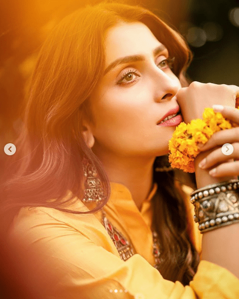 The super stunning Ayeza Khan has always impressed her fans with every project. She is heavenly gorgeous and her photoshoots always prove it right. As we know that Ayeza has endorsed various brands this year, she has gained all praise from her fans. She has been posting amazing photos on her Instagram while instantly grabbing attention. In her latest photoshoot, she is spreading around vibrant hues and we are simply falling in love with her traditionally rich look. Check out Ayeza Khan's latest photoshoot! Ayeza Khan Spreading Vibrant Colours in Latest Shoot! Here we have got the latest photoshoot of Ayeza Khan in which she is wearing a rainbow of vibrant colours with an enchanting smile on her face. Moreover, her khussa is adding up to the cultural elegance of the attire. Take a look at these clicks! The finest touch of mehndi and floral jewellery is an outstanding combination. Moreover, Ayeza's antique jewellery is making her overall look absolutely stunning. A combination of pink and yellow is everything about creativity that gives pleasant vibes.  About Ayeza A very few people know that Ayeza’s real name is Kinza Khan and she is known by her stage name Ayeza Khan. She was born on 15 January 1991. Ayeza Khan has played the lead roles in several dramas including Zard Mausam, Adhoori Aurat, Mere Meherbaan, Do Qadam Door Thay, Pyarey Afzal, Tum Kon Piya, Mohabbat Tumse Nafrat Hai, Koi Chand Rakh, Yaariyan. Moreover, she also received a great commendation for her portrayal as Mehwish in Mere Paas Tum Ho. Ayeza is the recipient of several awards including Lux Style Awards, Hum Awards, and Pakistan International Screen Awards. As far as her marital life is concerned, Danish Taimoor, a famous actor and host is Ayeza’s husband. The couple has two kids, a daughter, and a son.