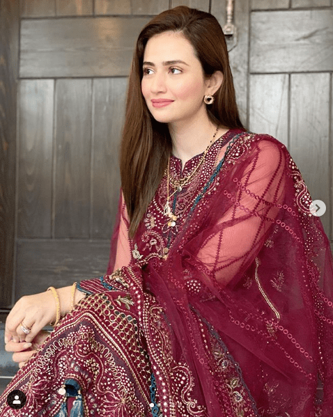 Sana Javed has got something new for the fans after her wedding. She is the epitome of beauty and makes it evident with every photoshoot coming her way. Sana dresses up the elegance and that's what makes her stand out from the rest. Since the beginning of this year, she is mostly going into traditional photoshoots and we are loving the way she carries it. No matter what, she is all in all perfect for every dress she chooses to wear. This time, the unique thing is that she has got a post-wedding glow on her face and that spellbinding smile she stretches on her face making her beautiful inside out. Check out some clicks from her latest photoshoot here! Sana Javed Wears Maroon in Latest Photoshoot! Here we have got clicks of Sana Javed wearing a delicately designed Maroon dress by Jazmin. A fine sprinkle of embellishment all over the dress makes it perfect choice to wear at the festive winter occasions. Take a look at these clicks! Some More Clicks From Insta Gallery of Sana Javed! Here we have got some more clicks from Sana's Instagram gallery in which she is setting new fashion goals for her fans. The simplicity and the sophistication are unmatchable! Have a look at these magnificent pictures!   About Sana Javed Sana Javed was born on 25 March 1993 in Jeddah, Saudi Arabia and she is 27 years old. She got her schooling done from Karachi Grammer School whereas she completed her Graduation from the University of Karachi. She can speak three languages i.e. Urdu, English, and Punjabi. Her start is Aries whereas her hobbies include listening to music & acting. Her height is 5 feet 4 inches.  So, what do you think about Sana's latest photoshoot and her beautifully designed dress? Don't forget to share your valuable feedback with us!