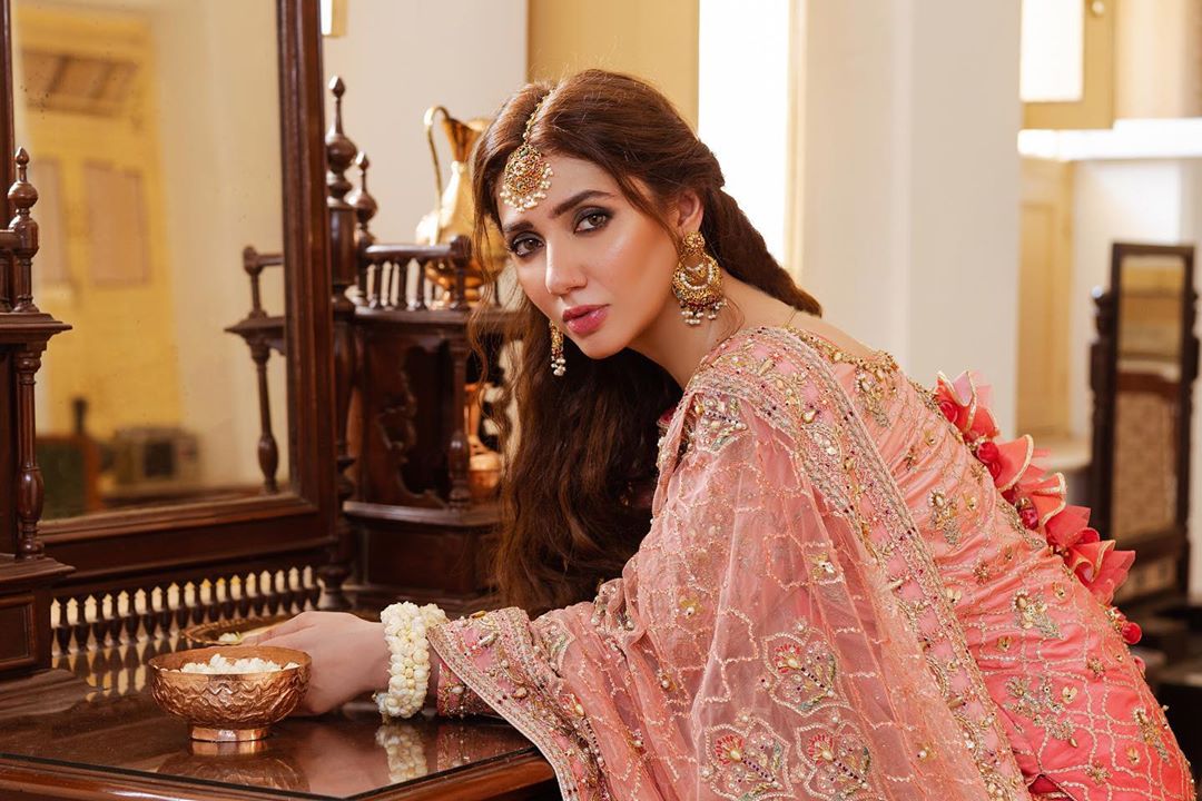 Mahira Khan is the epitome of beauty who has always spellbound her fans in whatever she wears. Whether it is about dressing up in the eastern or that in the western, Mahira makes sure to set new fashion goals. She is an amazingly talented actress who touched the peak of fame with her drama serial Hum Safar. Moreover, Mahira has also got an opportunity to work with Bollywood King, Shahrukh Khan. So, she has got a huge fan following from across the border as well. As far as Mahira's latest projects are concerned, she has got done with a sizzling hot photoshoot. Her clicks will not be letting you go anywhere else once after you see even a single picture. So, what are you waiting for? Let's have a look at Mahira Khan in her latest photoshoot. Mahira Khan - Latest Sizzling Hot Photoshoot! Mahira has always kept herself out of the criticism when it was about her dressing. She wears everything she loves whether it is bold and revealing or that of a traditional. The best thing is that she looks so gorgeous in all of these dresses. We have also seen Mahira wearing deep necks and backs most of the time and she looks stunning in that style as well. However, let's take a look on her latest shoot that will definitely blow you away! Mahira Khan - The Beauty In Black! In these pictures from the latest photoshoot, Mahira is wearing all black with some fine fancy touch that is all about elegance. Her deep revealing back is making her look hot and stunning in this attire.  Mustard Is Definitely A Must-Have! Mustard is a colour of celebration and it has got a fancy element that doesn't need any specific fancy work to enhance the look. Check out how Mahira has carried this beautiful multi-layered frock with symmetrical touch of ruffles. The sprinkle of embellishment all over the net dupatta is giving this attire a fascinating look. White Is Always Right In Fancy Collection! White has got its own charm and we cannot exclude it from the range of graceful fancy wears. Mahira has carried this simple yet formal and elegant dress in a classy manner that makes her stand out. Take a look! This frock is another masterpiece from the collection with revealing shoulders design. The expanding flare of the dress and ruffles look so attractive in latest fashion. The Bold and The Beautiful Mahira! Have a look at these sizzling hot clicks in which Mahira has made sure to slay her fans with her mesmerizing beauty.  Latest News About Mahira Khan We came too know that the beauty queen Mahira went through the test for COVID-19 and results showed her positive. She took this news to her Instagram and requested everyone to pray for her quick recovery. Here is what she posted on social media. We pray for Mahira's quick recovery and second her point of following SOPs so that we can ensure safety for everyone around.  So, what do you think about the latest photoshoot of Mahira? Don't forget to share your valuable feedback with us!