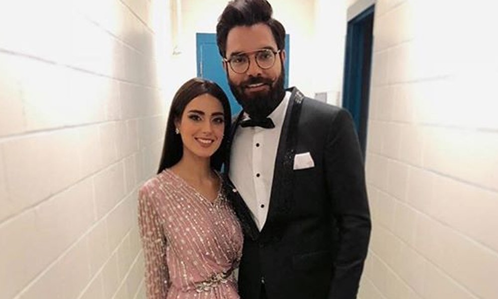 Yasir Hussain is known as one of the most outspoken celebrities in the industry. He always comments on controversies that turn out to be bitter for him. His fans on social media usually bash him for such statements, however, he has still got a great fandom. As we know that Yasir Hussain is married to the super-talented actress Iqra Aziz, we can never forget their love story as it went viral on social media. The couple had been dating for some time and as things were getting clear on the vision for the public, they also went for an international tour. Well... Yasir and Iqra faced huge criticism for going on such a tour when they didn't have any official relationship.  It was after that tour that Yasir proposed Iqra in the award show and things turned out fascinating for them. At every step, Yasir faced extreme bashing by his fans, however, he continued to be the same and that's the reason he is recognized as a controversial celebrity.  Cutting short here, for the first time Yasir has spoken up about how she fell in love with Iqra Aziz and she finally became his life partner. Check out the details and interview video here! Yasir Hussain Speaks About How He Fell For Iqra! While talking openly in Iffat Omer's 'Say It All' show, Yasir Hussain has finally revealed about how she got a special corner in the heart for Iqra.  He recalled the time when both of these celebs were in Toronto for the award show and Iqra somehow lost her phone. She was standing worried and helpless to search for her phone. Yasir told that he just approached her and calmed her down. As soon as he was there to show support, someone just appeared to handover the lost cellphone to Iqra. So, that was the start of interaction that eventually turned out as affectionate husband and wife relationship. Watch this clip from the interview! Yasir also mentioned that he met Iqra's mother who is such a pious lady that impressed him the most. Following the nature of her mother, Yasir decided to propose Iqra and this is how it all happened. Yasir and Iqra have an age difference of 11 years. 